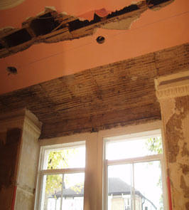 Before: A portion of the blown lath and plaster. St James Road, Sutton, SM1